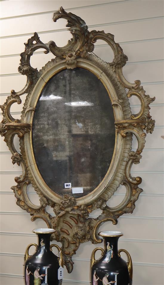 A Victorian gilt gesso and carved wood wall mirror, with an oval plate W.80cm